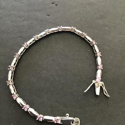 Silver tone, tennis bracelet with lavender rhinestones