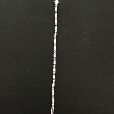 Silver tone, tennis bracelet with lavender rhinestones