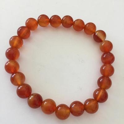 Beautiful orange & amber colored glass bead stretch bracelet