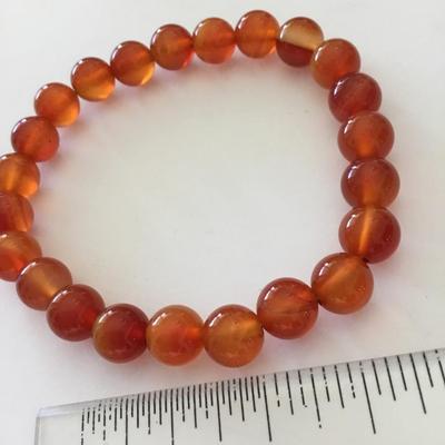 Beautiful orange & amber colored glass bead stretch bracelet