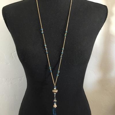 NRT Gold tone, light blue faceted, crystal tassel necklace