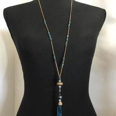 NRT Gold tone, light blue faceted, crystal tassel necklace