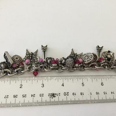 Beautiful vintage, silver toned, very nice charm cr bracelet