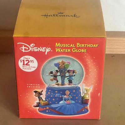 Sale Photo Thumbnail #11: Limited edition Hallmark Disney Musical Birthday Water Globe, celebrating Walt Disney’s 100th Birthday.
Features beloved Disney characters—Mickey & Minnie Mouse, Cinderella, Tinker Bell, Pinocchio, and a Dalmatian—around a base of blue and gold star