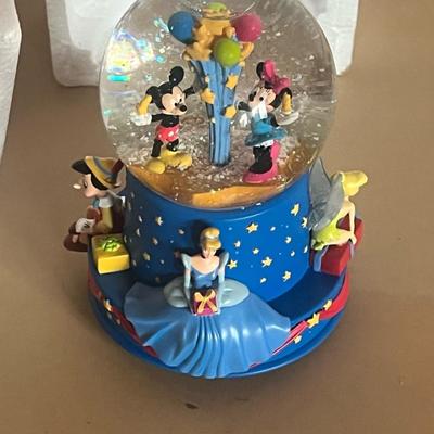 Sale Photo Thumbnail #12: Limited edition Hallmark Disney Musical Birthday Water Globe, celebrating Walt Disney’s 100th Birthday.
Features beloved Disney characters—Mickey & Minnie Mouse, Cinderella, Tinker Bell, Pinocchio, and a Dalmatian—around a base of blue and gold star