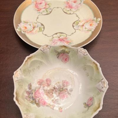 Sale Photo Thumbnail #29: Lovely pair of antique Prussian porcelain dishes, featuring hand-painted roses and elegant gold embellishment. The set includes:
1️⃣ RS Prussia shallow bowl – soft green fade, pink rose clusters, ornate scalloped rim, gold details.
2️⃣ C.J. Prus