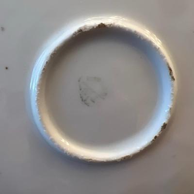 Sale Photo Thumbnail #56: Delicate antique German porcelain plate featuring a hand-painted pink rose motif, scalloped edge, and gold detailing. Embossed with elegant reliefs and dual handles, this piece exemplifies early 20th-century craftsmanship.
Details:
•	Maker: Likely RS Ge