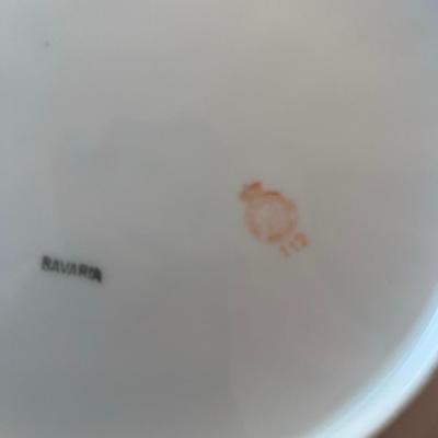 Sale Photo Thumbnail #60: Elegant vintage porcelain handled plate from Bavaria, featuring delicate pink roses and gold edging. The floral transfer pattern is typical of early 1900s Bavarian export porcelain, often produced by makers such as Zeh, Scherzer & Co. or R.S. Bavaria.
Det