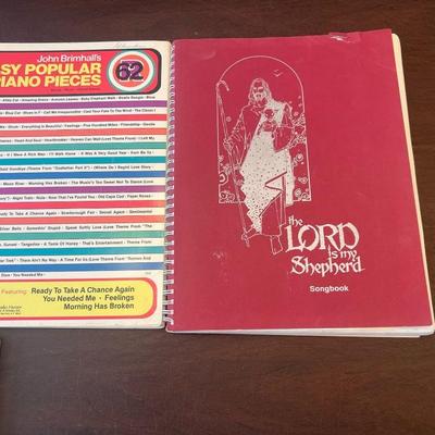 Sale Photo Thumbnail #68: Collection of four vintage spiral-bound piano instruction and song books featuring popular, classical, and sacred music from the 1960s–1980s.
Includes:
1.	75 Famous Piano Pieces – Bess Music Publishers, Merrimac Series No. 1 (colorful geometric cover;
