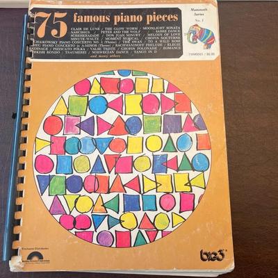 Sale Photo Thumbnail #70: Collection of four vintage spiral-bound piano instruction and song books featuring popular, classical, and sacred music from the 1960s–1980s.
Includes:
1.	75 Famous Piano Pieces – Bess Music Publishers, Merrimac Series No. 1 (colorful geometric cover;