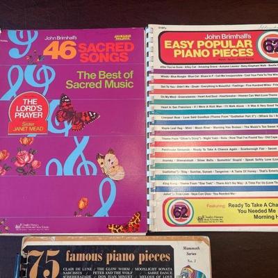 Sale Photo Thumbnail #69: Collection of four vintage spiral-bound piano instruction and song books featuring popular, classical, and sacred music from the 1960s–1980s.
Includes:
1.	75 Famous Piano Pieces – Bess Music Publishers, Merrimac Series No. 1 (colorful geometric cover;