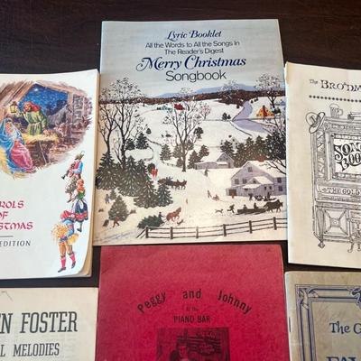 Sale Photo Thumbnail #80: Assorted collection of vintage and mid-century softcover songbooks featuring classic Christmas carols, parlor songs, and Americana standards. A nostalgic lot perfect for pianists, collectors, or seasonal décor.
Includes:
1.	Carols of Christmas – Music 