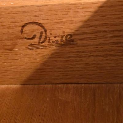 Mid-century modern walnut nine-drawer lowboy dresser by Dixie Furniture Co. with a matching mirror.