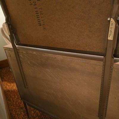 Mid-century modern walnut nine-drawer lowboy dresser by Dixie Furniture Co. with a matching mirror.