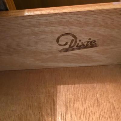 Mid-century modern walnut nightstand or side table by Dixie Furniture Co. with brass lamp and an alarm clock