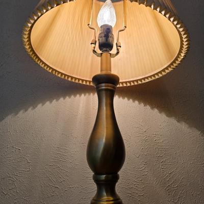 Mid-century modern walnut nightstand or side table by Dixie Furniture Co. with brass lamp and an alarm clock