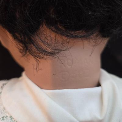 Handcrafted porcelain doll collectible named "Tuffy", created by Seena Hallig