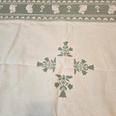 handmade green and white crochet blanket with a leaves pattern and fringed edges with a knitted reverse cat themed throw