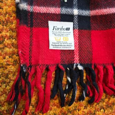 Cuddl Duds® Red Plaid blanket with a vintage Faribo red, black, and white plaid acrylic throw blanket with fringe, made by the Faribault...