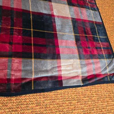 Cuddl Duds® Red Plaid blanket with a vintage Faribo red, black, and white plaid acrylic throw blanket with fringe, made by the Faribault...