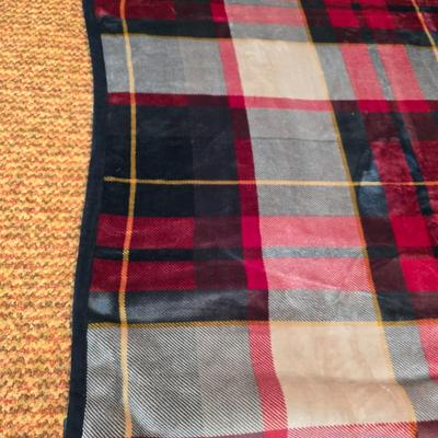 Cuddl Duds® Red Plaid blanket with a vintage Faribo red, black, and white plaid acrylic throw blanket with fringe, made by the Faribault...