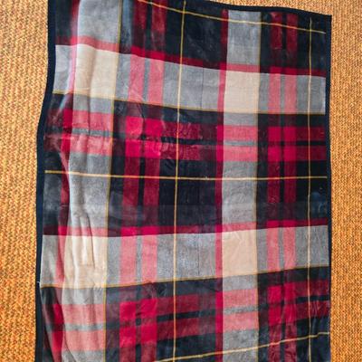 Cuddl Duds® Red Plaid blanket with a vintage Faribo red, black, and white plaid acrylic throw blanket with fringe, made by the Faribault...