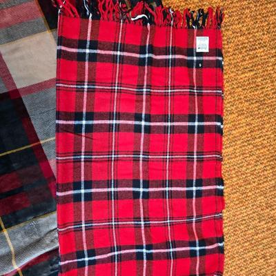 Cuddl Duds® Red Plaid blanket with a vintage Faribo red, black, and white plaid acrylic throw blanket with fringe, made by the Faribault...