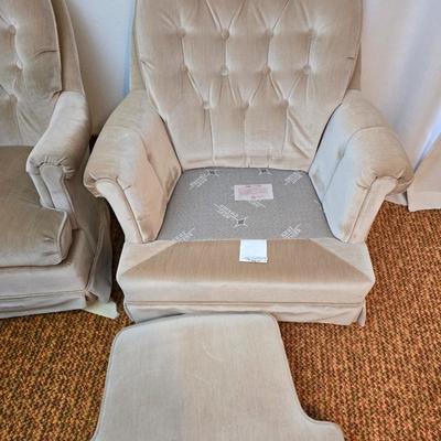 Pair of Best Chairs Inc. upholstered swivel rocker chairs with tufted backs and skirted bases.