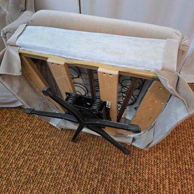 Pair of Best Chairs Inc. upholstered swivel rocker chairs with tufted backs and skirted bases.