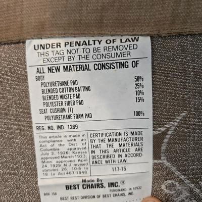 Pair of Best Chairs Inc. upholstered swivel rocker chairs with tufted backs and skirted bases.