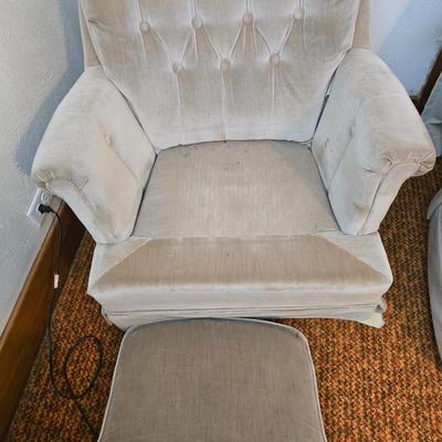 Pair of Best Chairs Inc. upholstered swivel rocker chairs with tufted backs and skirted bases.