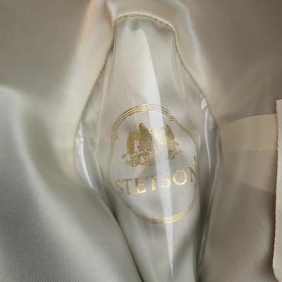 Bronzine felt Stetson Sutley fedora hat with a black grosgrain ribbon and feather accent. Size 7 1/4