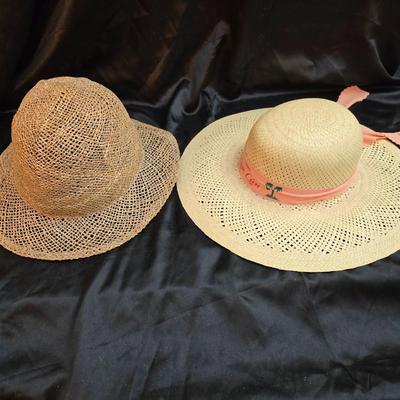 Two vintage straw sun hats for the ladies - wide-brimmed straw sun hat with a pink Can Cun ribbon