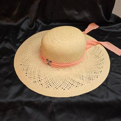 Two vintage straw sun hats for the ladies - wide-brimmed straw sun hat with a pink Can Cun ribbon