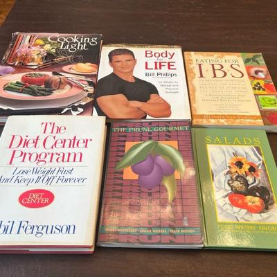 Sale Photo Thumbnail #96: Includes Cooking Light 1988, Body for Life by Bill Phillips, Eating for IBS by Heather Van Vorous, The Diet Center Program by Sybil Ferguson, The Prune Gourmet, and Salads: Food Writers’ Favorites. A diverse group of nutrition and wellness-themed cookbo