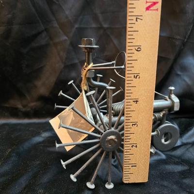 Days Of Splendor” John Deere framed artwork and a brutalist metal nail sculpture depicting a farmer on a tractor, created by artist...