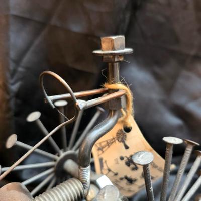 Days Of Splendor” John Deere framed artwork and a brutalist metal nail sculpture depicting a farmer on a tractor, created by artist...