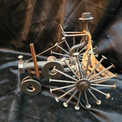 Days Of Splendor” John Deere framed artwork and a brutalist metal nail sculpture depicting a farmer on a tractor, created by artist...