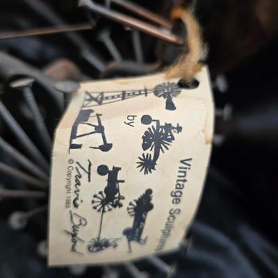 Days Of Splendor” John Deere framed artwork and a brutalist metal nail sculpture depicting a farmer on a tractor, created by artist...