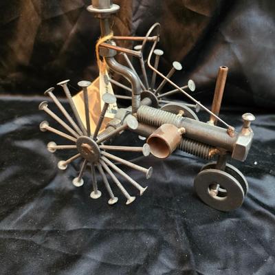 Days Of Splendor” John Deere framed artwork and a brutalist metal nail sculpture depicting a farmer on a tractor, created by artist...
