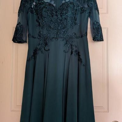 Sale Photo Thumbnail #102: Elegant JJ’s House Wedding & Special Occasions dress in deep teal chiffon with intricate beaded lace applique and sheer three-quarter sleeves. Features a sweetheart-lined bodice with illusion neckline and flowing A-line skirt. Size: 14 (per tag). Brand 