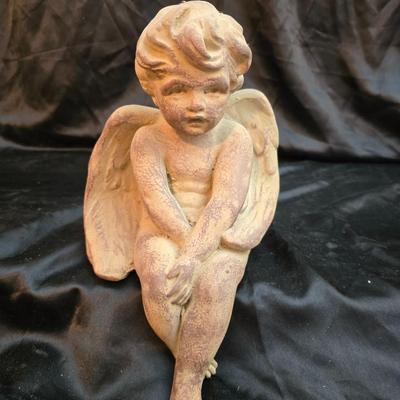 sitting cherub angel garden statue with two faux decorative garden stones