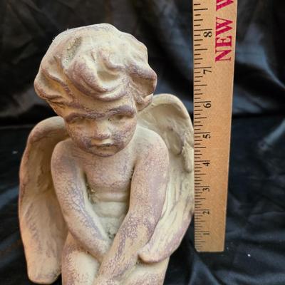 sitting cherub angel garden statue with two faux decorative garden stones