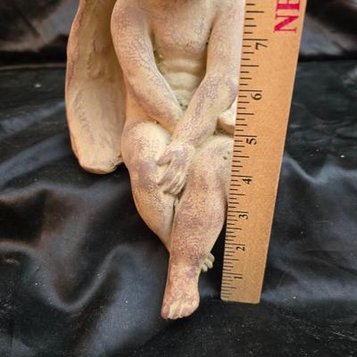 sitting cherub angel garden statue with two faux decorative garden stones