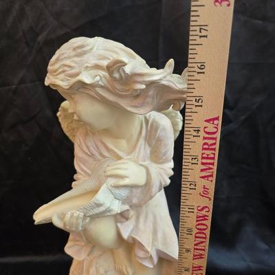 Large angel holding a seashell yard /garden or home art.