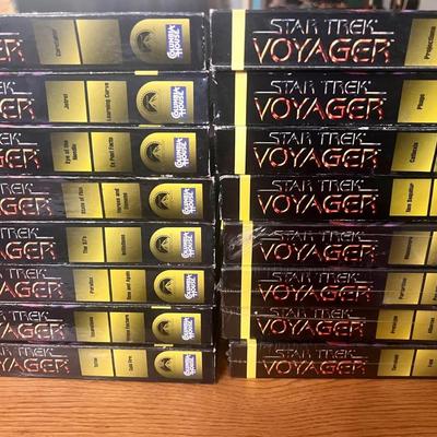 Sale Photo Thumbnail #107: Extensive Star Trek: Voyager VHS lot featuring early season episodes released by Paramount Home Video. Includes 22 tapes with two episodes per volume, covering key storylines such as Caretaker, Eye of the Needle, Learning Curve, Projections, Cold Fire, an