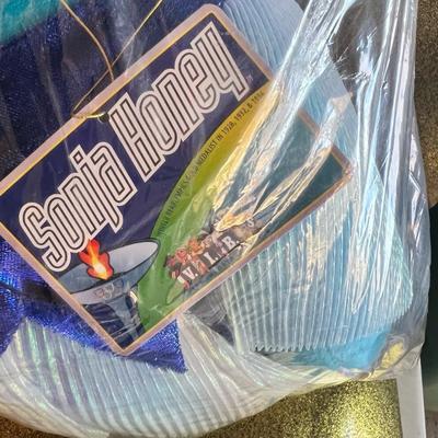 Sale Photo Thumbnail #126: This is an original American Bear Company V.I.B.S. (Very Important Bears) collectible plush titled “Sonja Honey.”
Inspired by legendary Olympic skater Sonja Henie, this Winter Bearlympics edition features:

Bright turquoise plush bear

Original Bearly