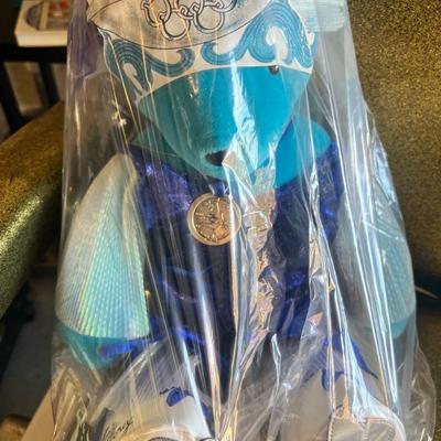 Sale Photo Thumbnail #127: This is an original American Bear Company V.I.B.S. (Very Important Bears) collectible plush titled “Sonja Honey.”
Inspired by legendary Olympic skater Sonja Henie, this Winter Bearlympics edition features:

Bright turquoise plush bear

Original Bearly