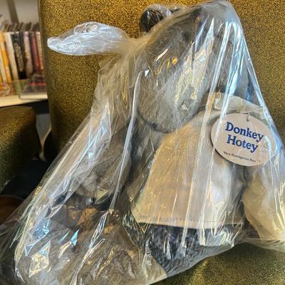 Sale Photo Thumbnail #128: A rare and highly collectible American Bear Company plush from the V.O.P. (Very Outrageous Pets) series.
This character is a humorous literary parody titled “Donkey Hotey,” inspired by Don Quixote.

Features include:

Donkey-style plush with soft grey