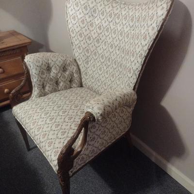 Vintage Wingback Chair with Carved Wood Arms and Legs and Button Tufted Accent